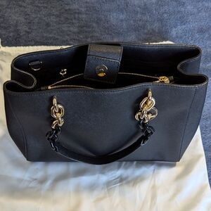 New Michael Kors Medium Tote Black handbag with gold hardware and chain.